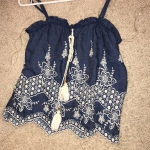 Denim top with white emboidery